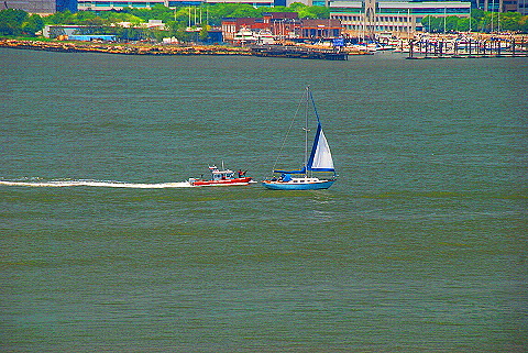 NY-Fleet_Week_2009-04-Police_Boat_Chases_Down_Sailboat.JPG