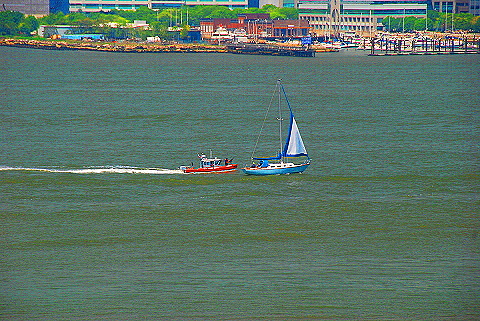 NY-Fleet_Week_2009-06-Police_Boat_Chases_Down_Sailboat.JPG