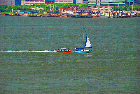 NY-Fleet_Week_2009-08-Police_Boat_Chases_Down_Sailboat.JPG