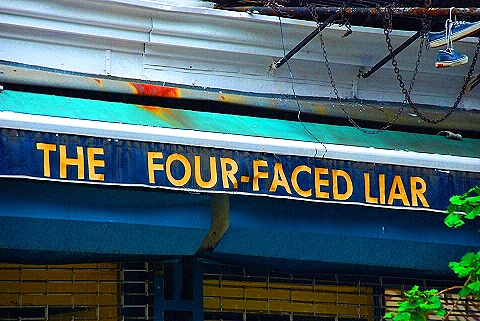 NY-Greenwich_Village_Summer-39-Signs-The_Four_Faced_Liar.JPG